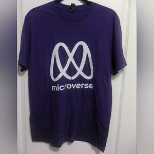 “Step into the world of Microverse with this eye-catching purple T-shirt featuri